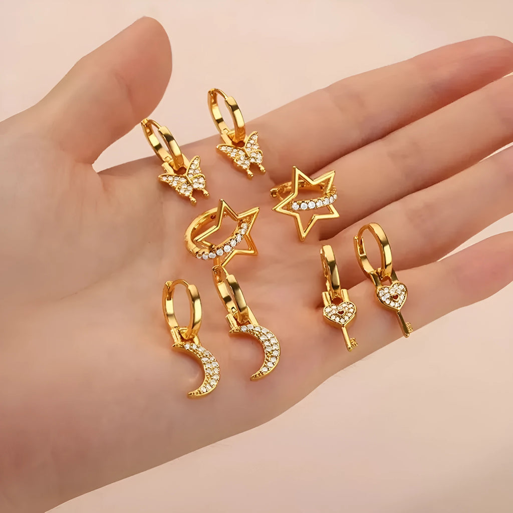 Women's copper butterfly earrings with geometric heart, star, and bow shapes and cubic zirconia stones.