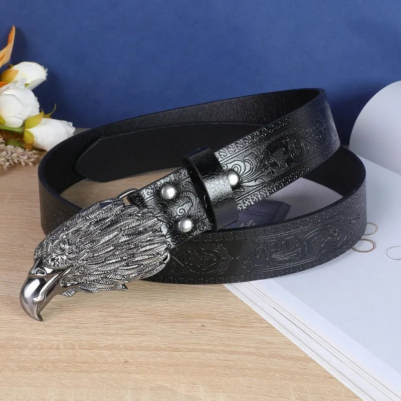 Men's black belt with detailed alloy cow head buckle showing carved and embossed design on imitation leather strap