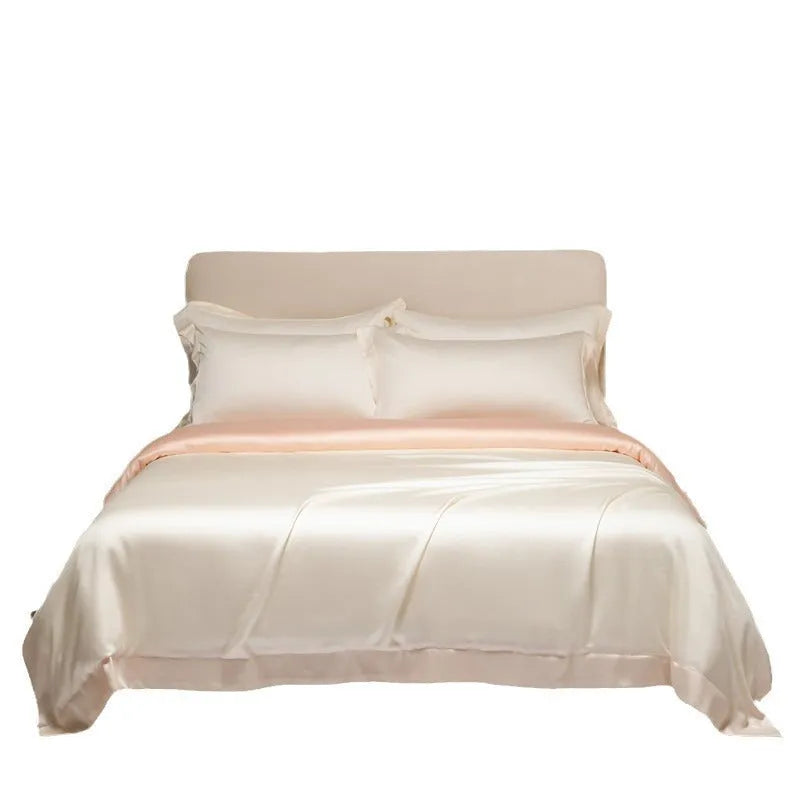 Four-piece Lenzing Tencel quilt sheet set in Antique White showing quilt cover and pillowcases with modern simple style