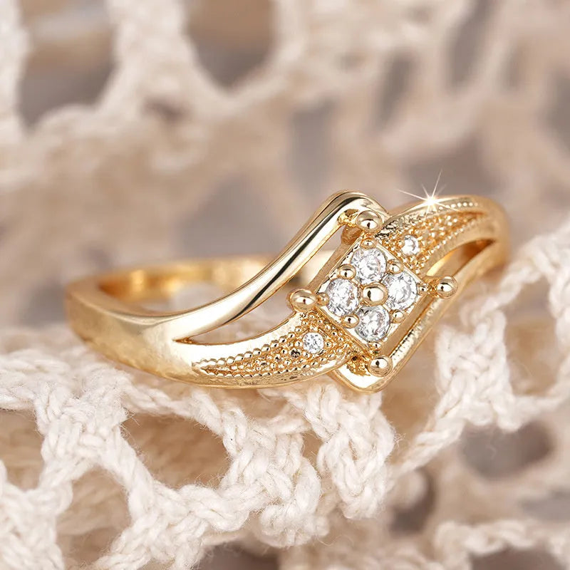 Yellow gold coloured copper diamond ring with geometric design and micro inlaid zircon detailing