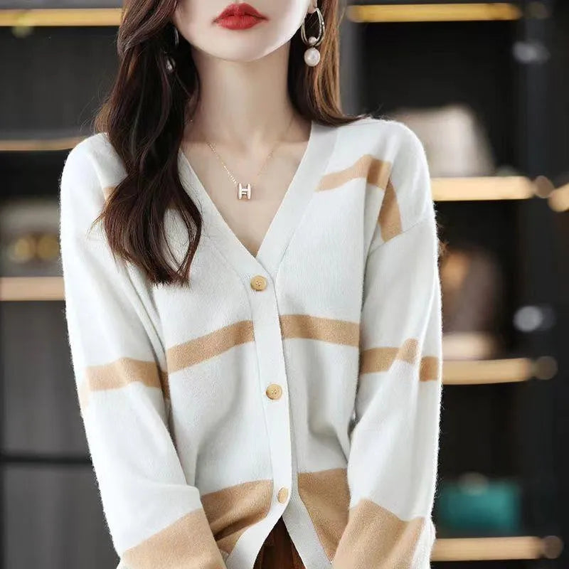 Women's black and white striped V-neck knitted cardigan with a 3D pattern and slim fit.