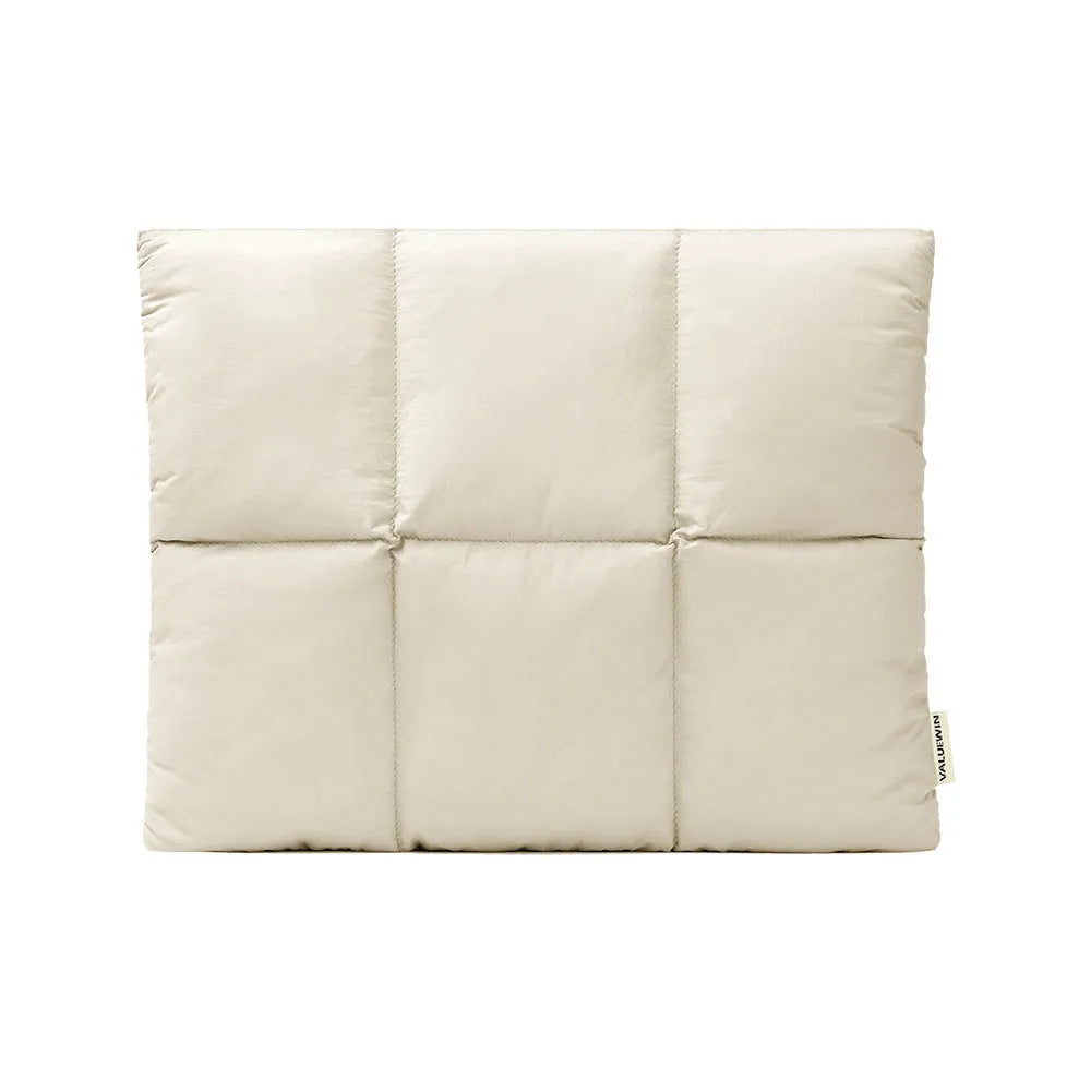 Soft fluffy polyester laptop sleeve in black and khaki colours on a table, showing sewing thread detail and size options.