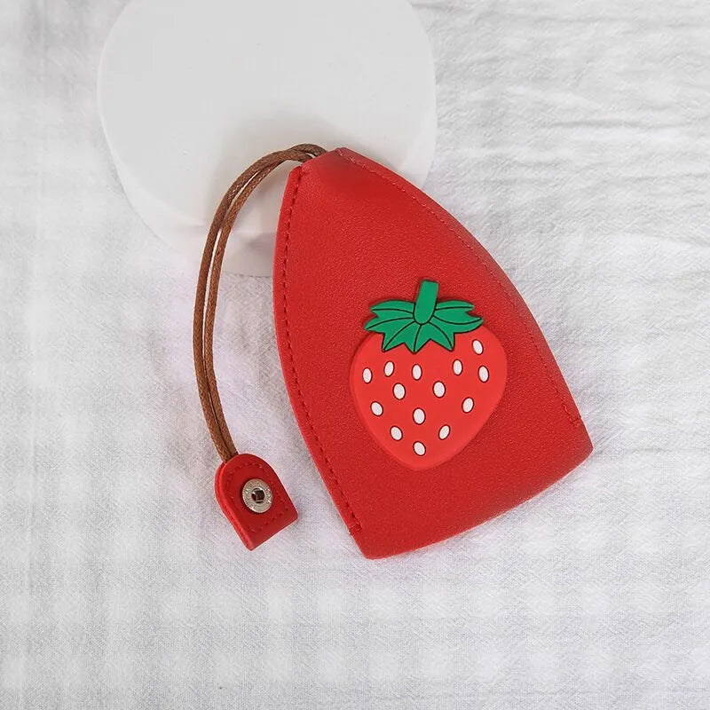Colourful cartoon pull-out key case made from PU leather, showing the key extended from its protective sleeve.