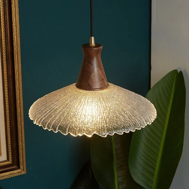 Retro style wooden and brass chandelier with glass shade ceiling lamp for restaurants.
