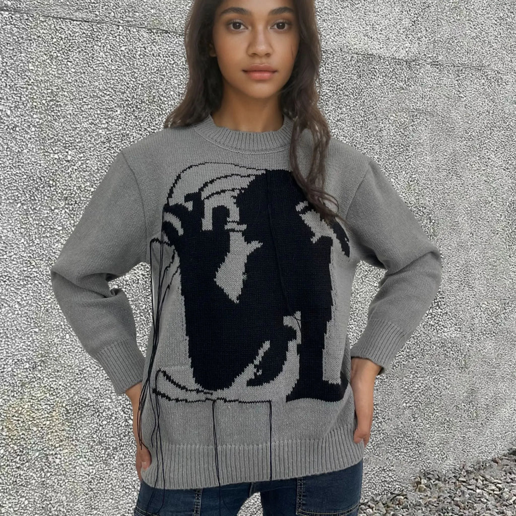 Women's grey alpaca wool sweater with abstract pattern and tassel design on front