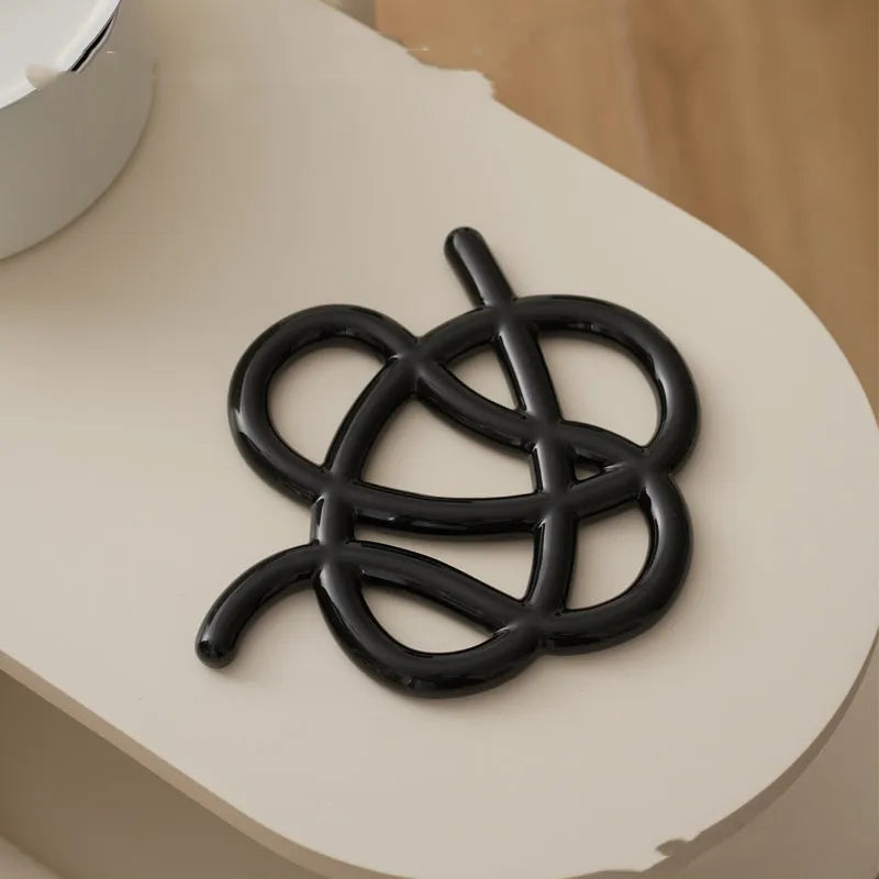 Ceramic heat proof mat in irregular shape with hook for hanging storage