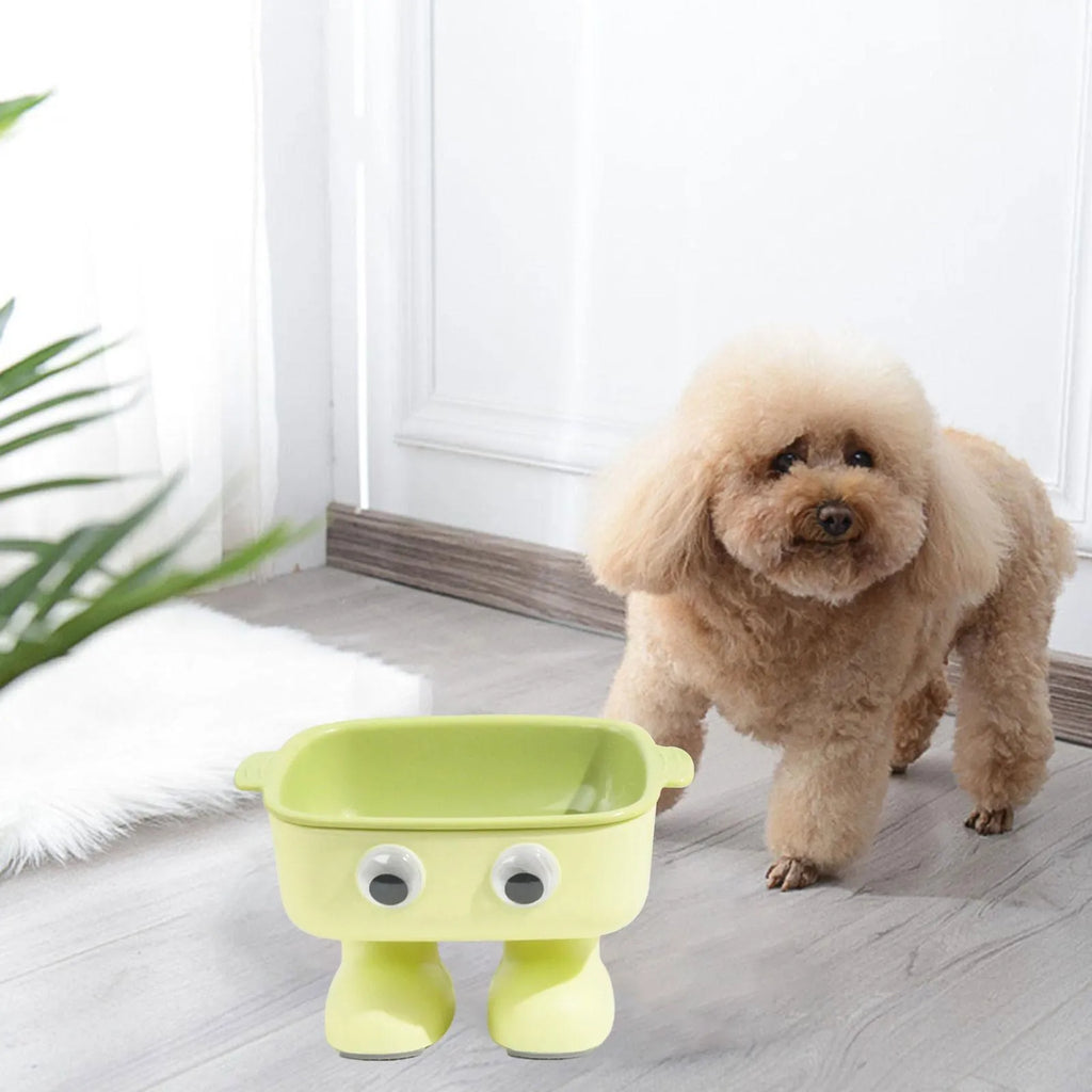 Robot-shaped elevated cat bowl with tilted feeding surface in green colour
