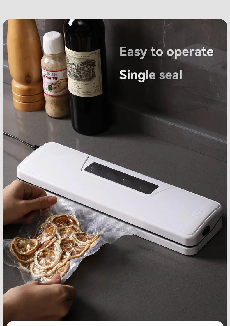 White automatic vacuum sealer machine on a kitchen countertop.