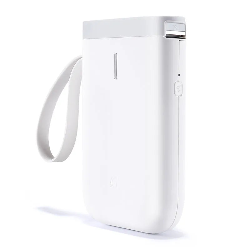 D11 compact white Bluetooth thermal label printer with USB cable and roll of label paper on a desk.