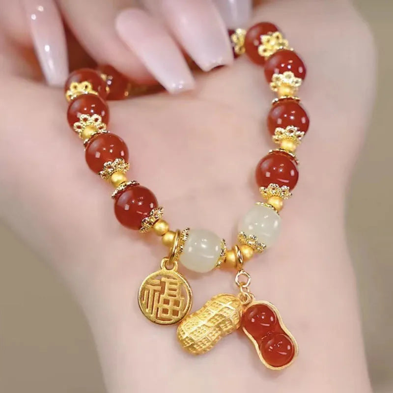 Chinese style handmade glass bead bracelet with bamboo joint elements on a white background.