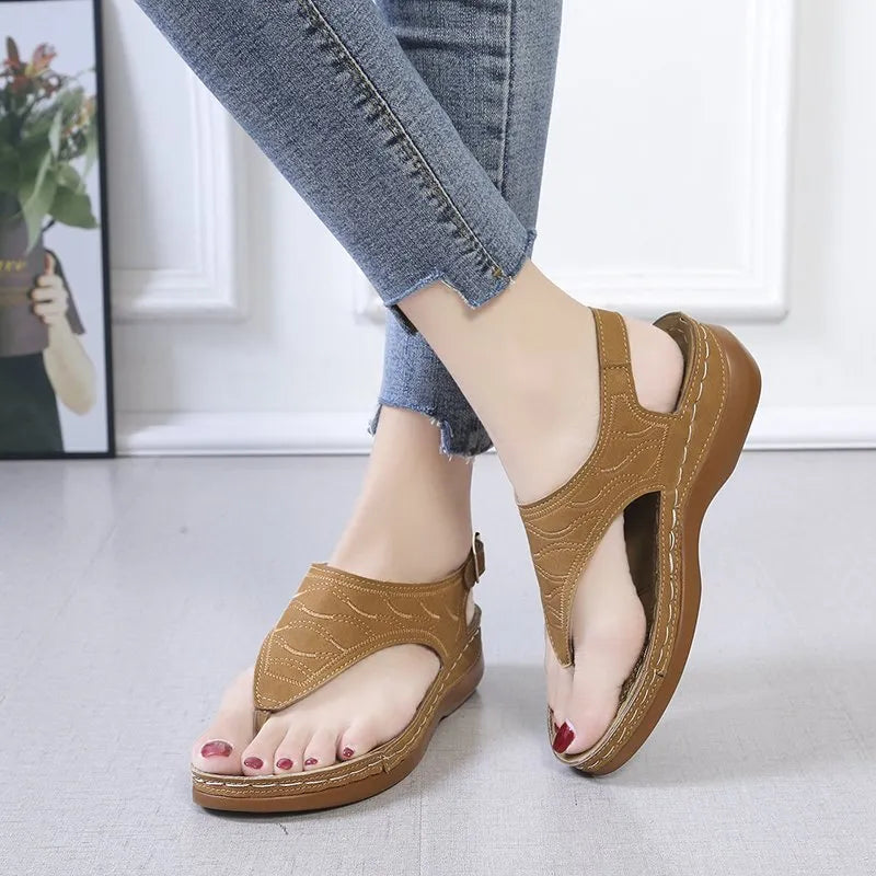 Women's casual wedge-heel sandals with adjustable buckle strap in a solid colour.