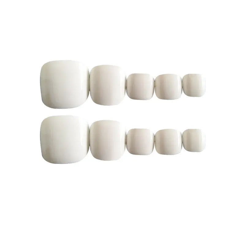White false toenails with starry sky pattern and included glue for press-on application