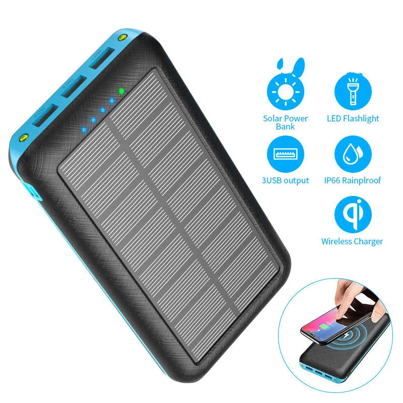 Black portable power bank with Qi wireless charging pad and three USB ports on the side