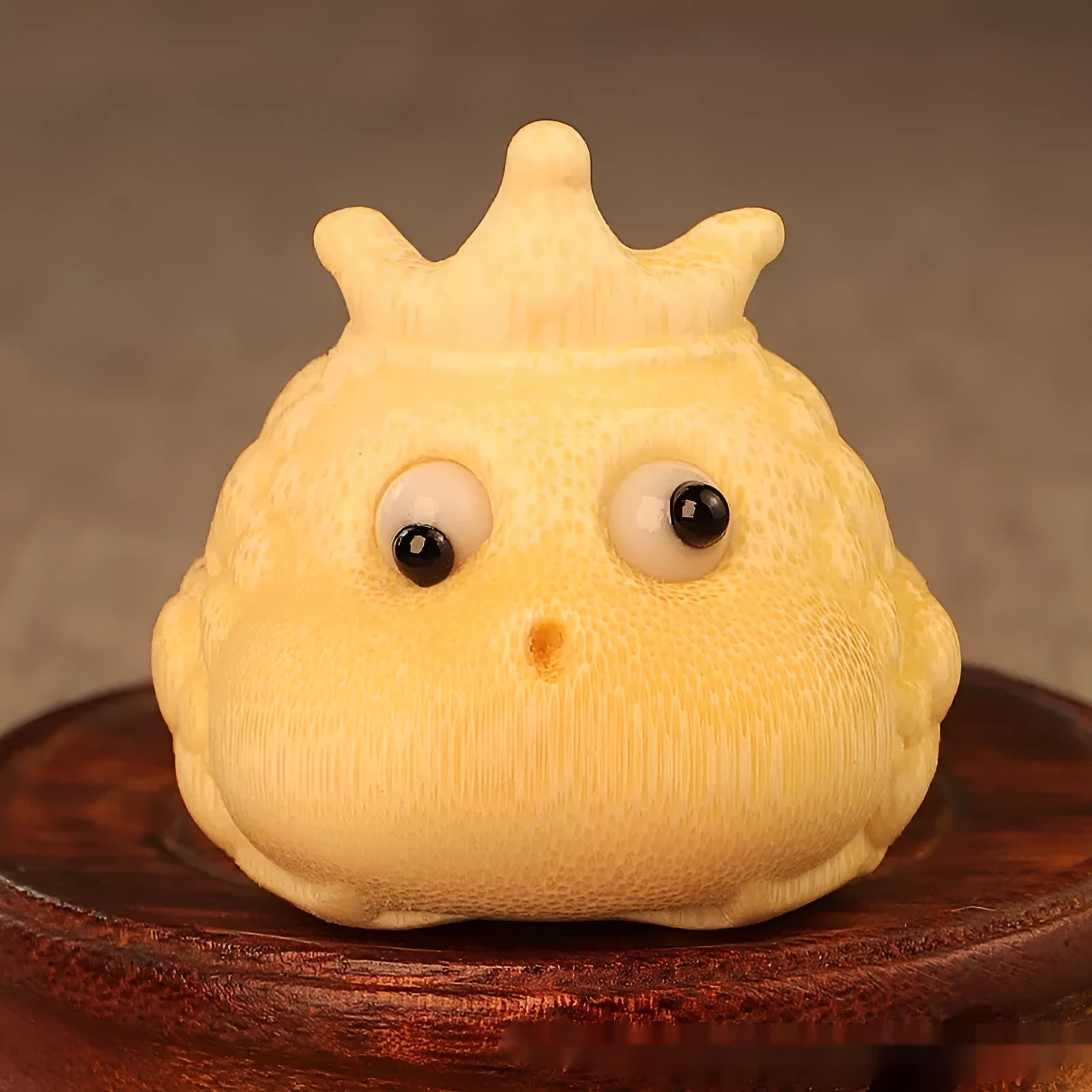 Hand-carved bamboo sculpture of a cute Crown Princess toad ornament.