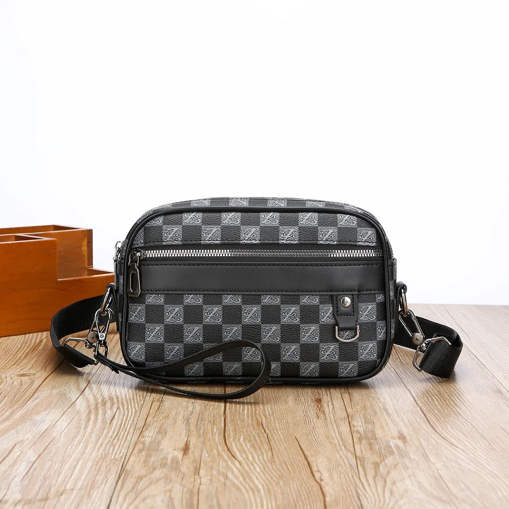 Men's black geometric pattern messenger bag shown in horizontal carrying position with shoulder strap