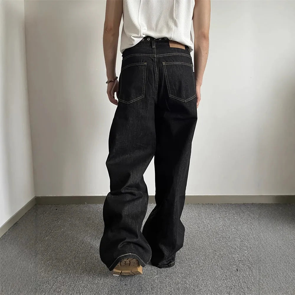 Retro black wide-leg jeans with straight-leg styling and zip fly opening