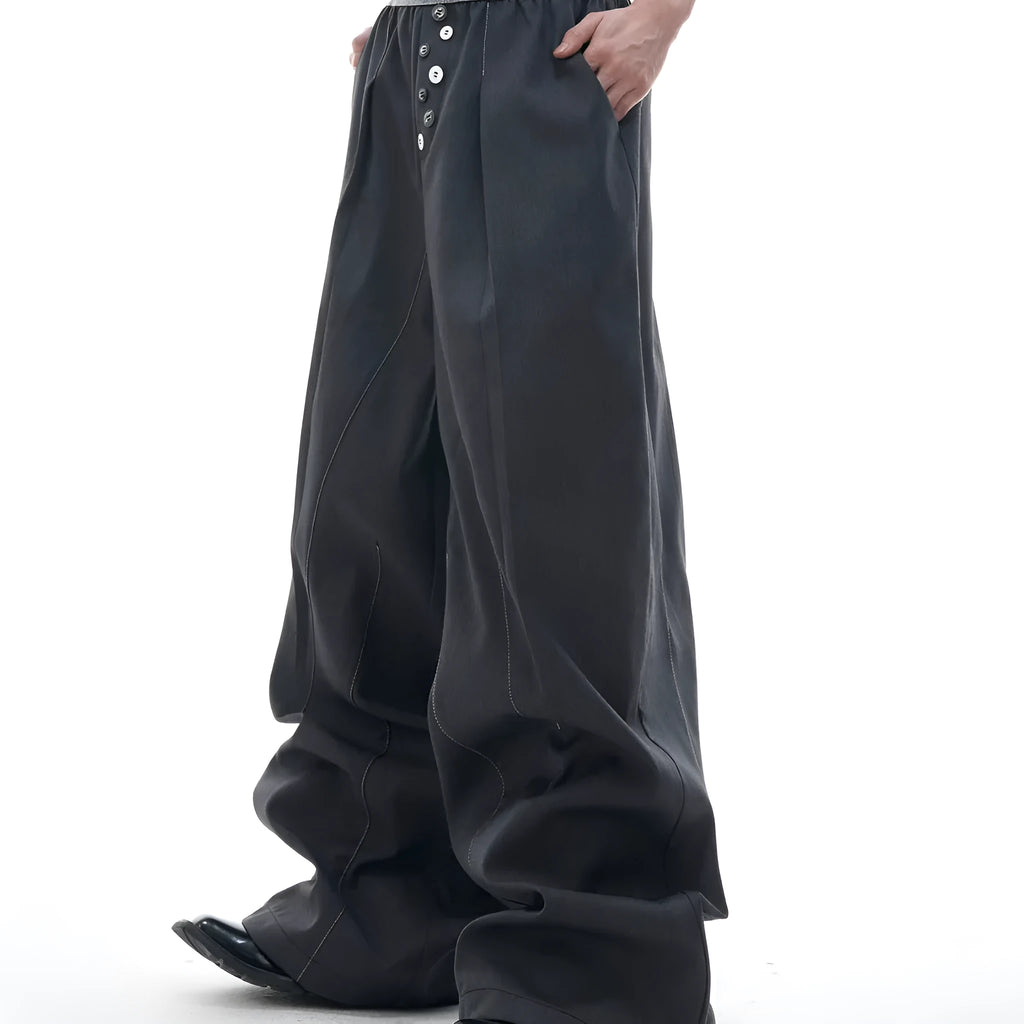 Drooping straight-leg casual trousers with button open line detail in black or grey colours