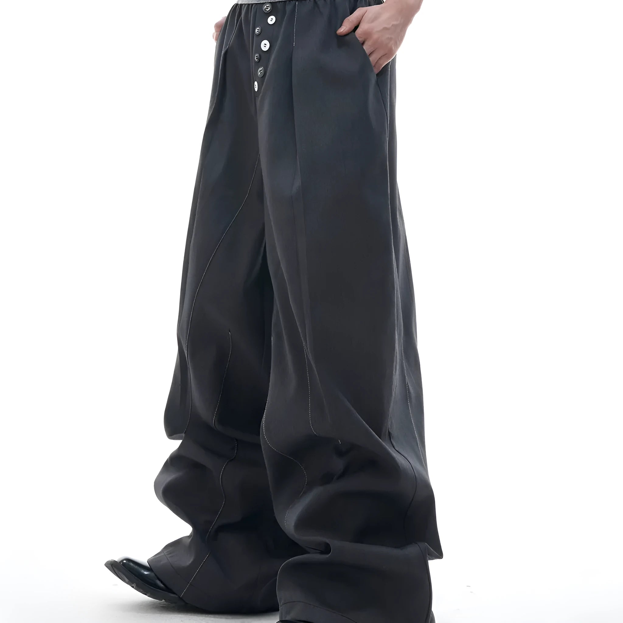 Drooping straight-leg casual trousers with button open line detail in black or grey colours