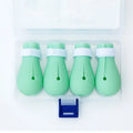 Set of four green silicone cat anti-scratch foot covers or gloves for pet handling.