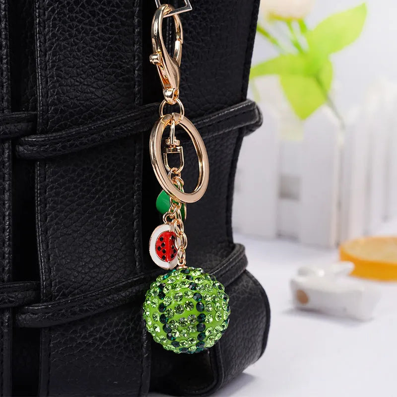 Green watermelon slice keychain made from zinc alloy measuring 12cm long