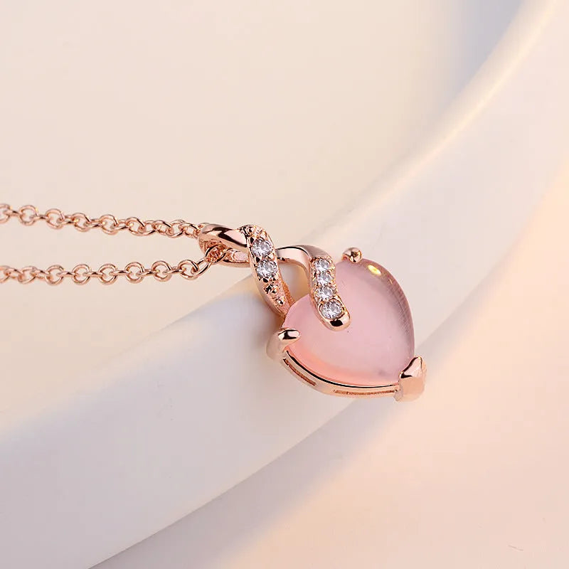 Women's heart-shaped pink artificial crystal pendant necklace with rose gold cross chain