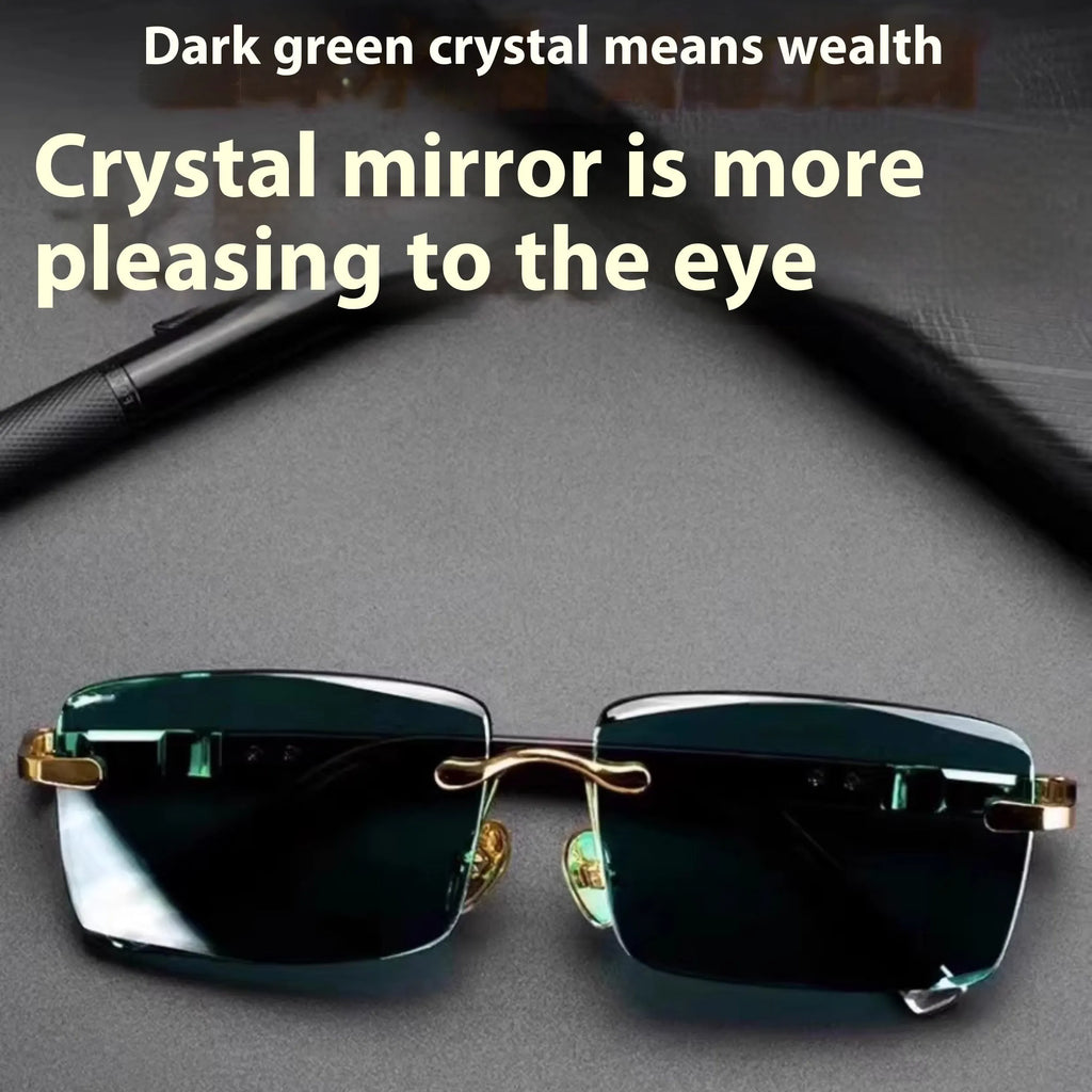Dark green frameless crystal sunglasses inside a hard case with a cleaning cloth.