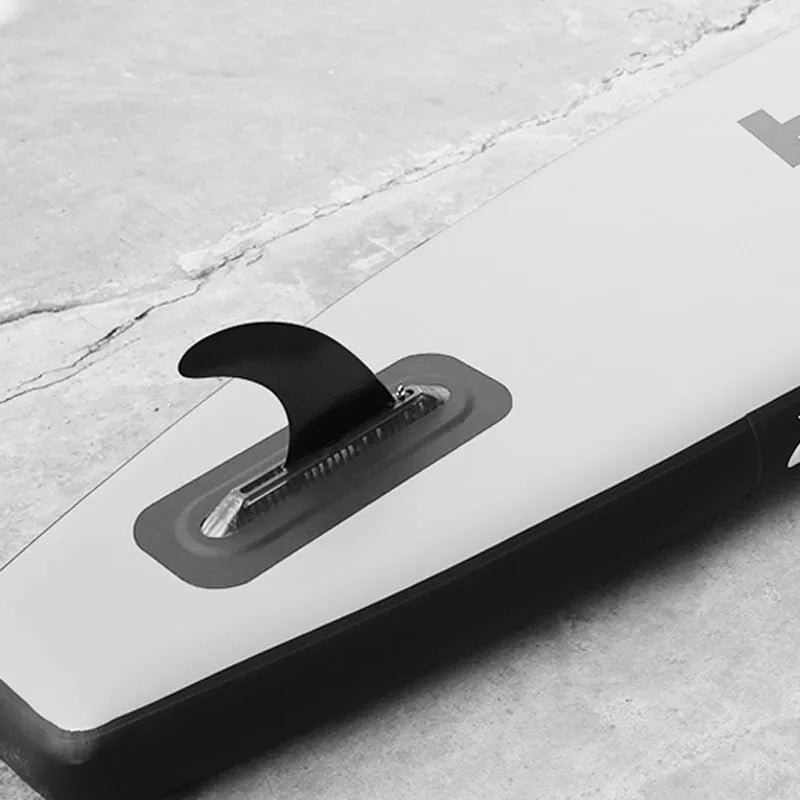 SUP paddle with attached plastic water dispenser and large removable fish fins