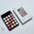Mini portable wireless keyboard in macaron mixed colours on a desk.