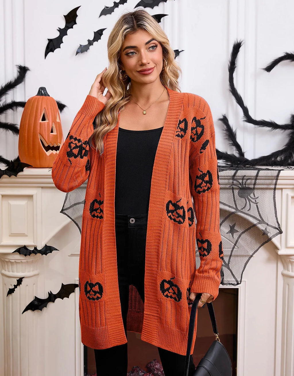 Women's black Halloween cardigan with orange pumpkin head jacquard knit pattern, straight cut with regular sleeves