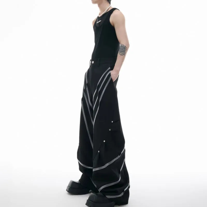 Men's trousers with deconstructed cut, metal striped rivets on pleats, and polyester fabric in black bottom colour