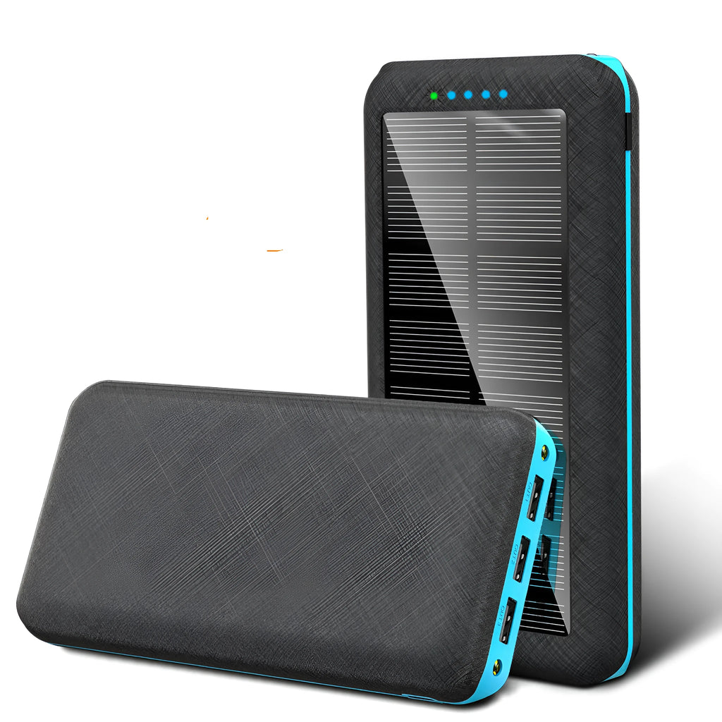 Black portable power bank with Qi wireless charging pad and three USB ports on the side