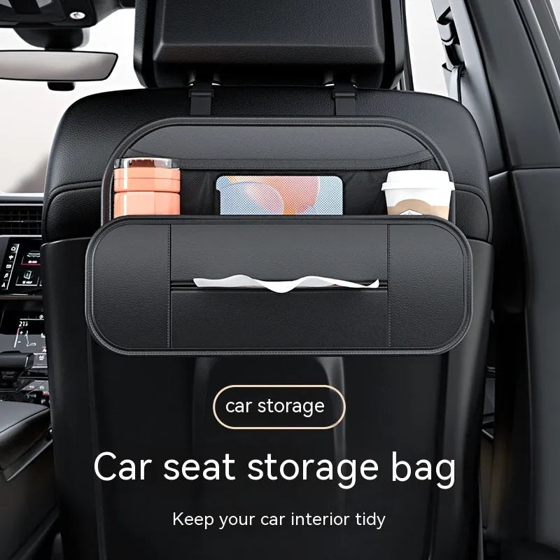 Black leather car seat rear storage bag measuring 36x24x8cm hanging on a vehicle seat back