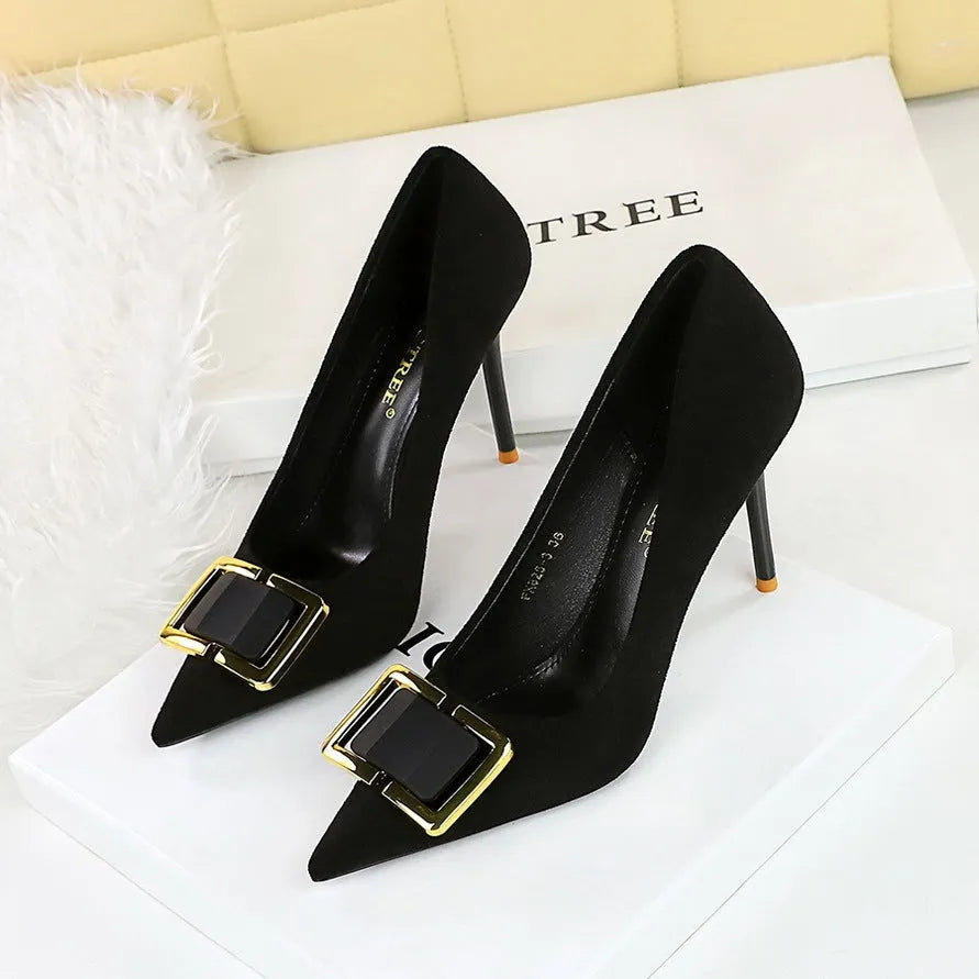 Black suede women's stiletto high heels with a pointed toe and a 9CM high heel on a rubber sole.