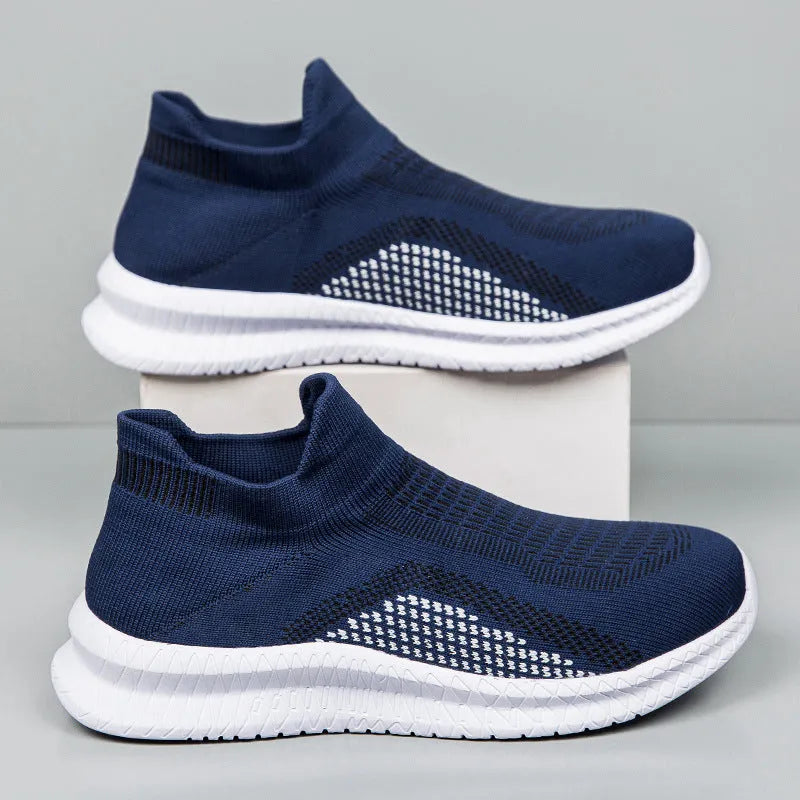 Men's white popcorn flyknit low-top casual sneakers on a plain background