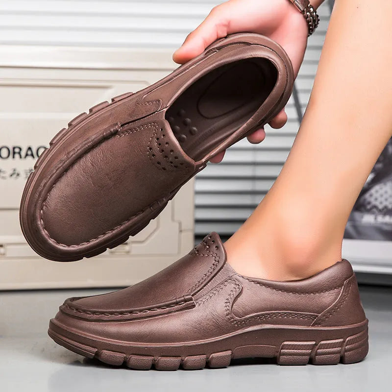 Men's black slip-on loafers with platform sole and round toe design