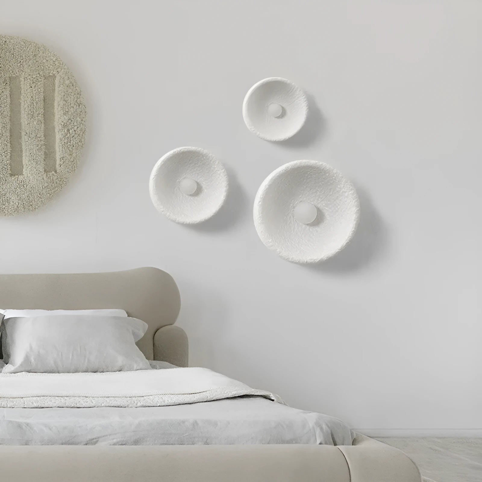 Japanese-style modern simple wall lamp with a round resin shade in warm white light.