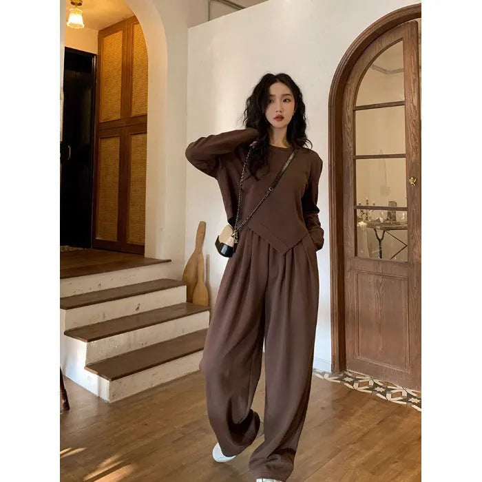 Women's khaki casual sports suit with loose-fit long sleeve top and matching trousers.