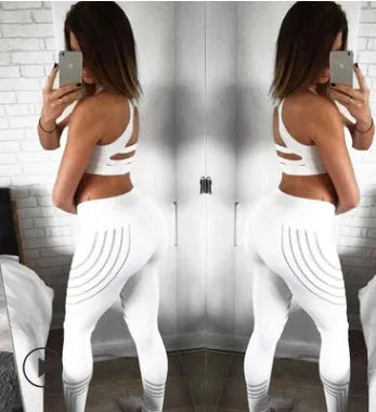 Women's black printed Milk Silk workout leggings with a slim fit, shown from the side.