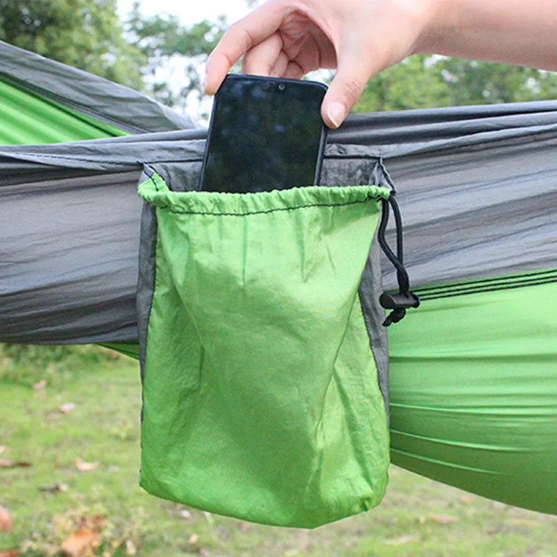 Blue nylon parachute cloth camping hammock measuring 270x140cm suspended outdoors
