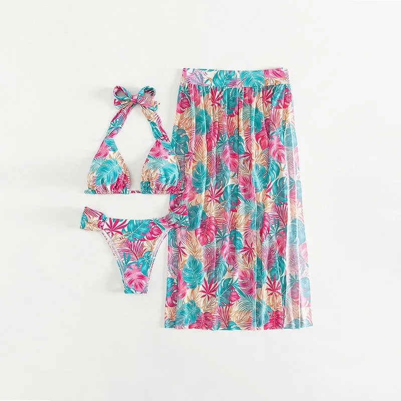 Women's three-piece swimsuit set with floral print, mesh beach skirt, and split design in picture colour.