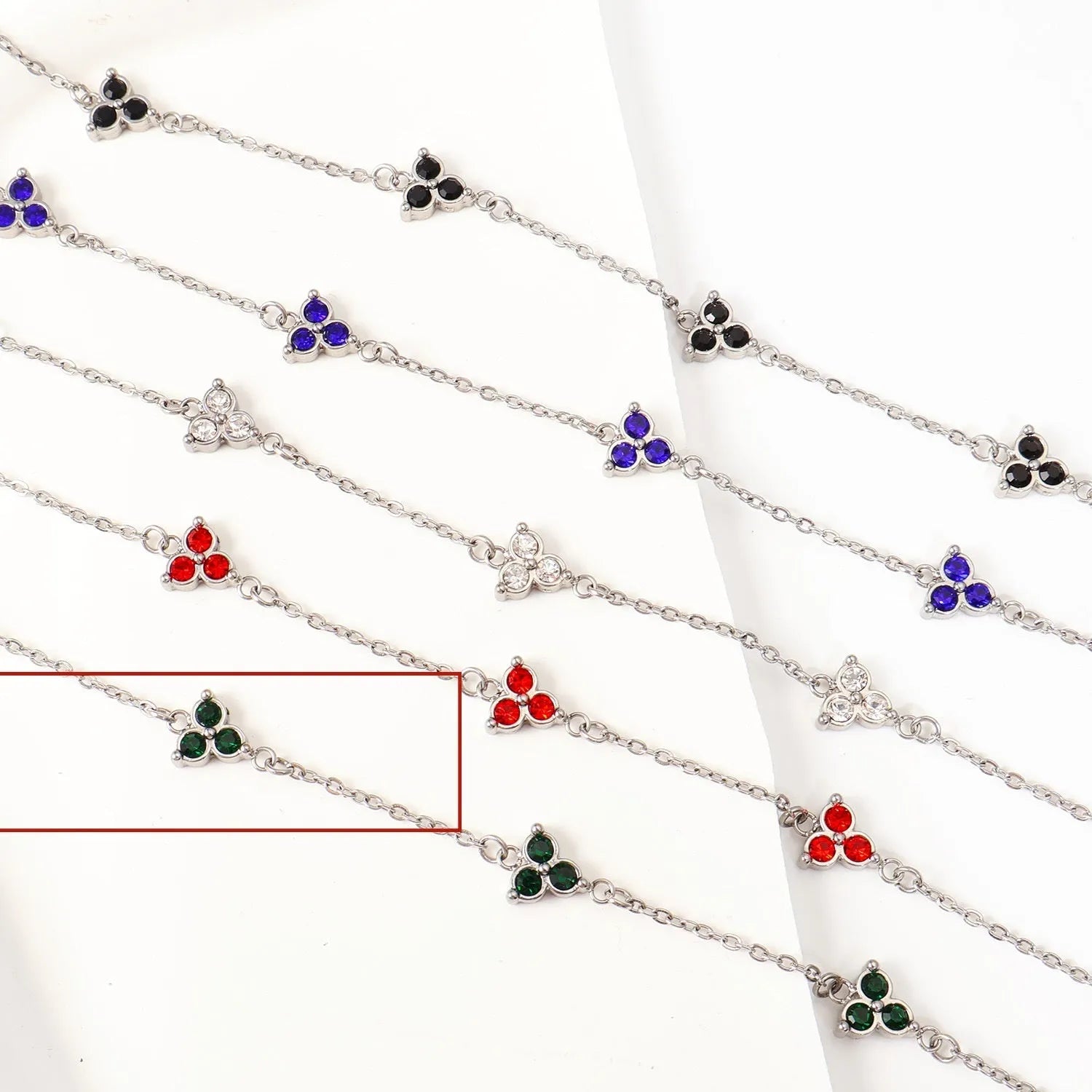 Stainless steel women's bracelet with three geometric diamond shapes and triangle elements