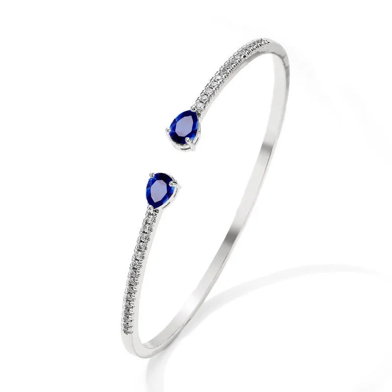 Multi-zircon copper bracelet with inlaid stones in blue or white colour options