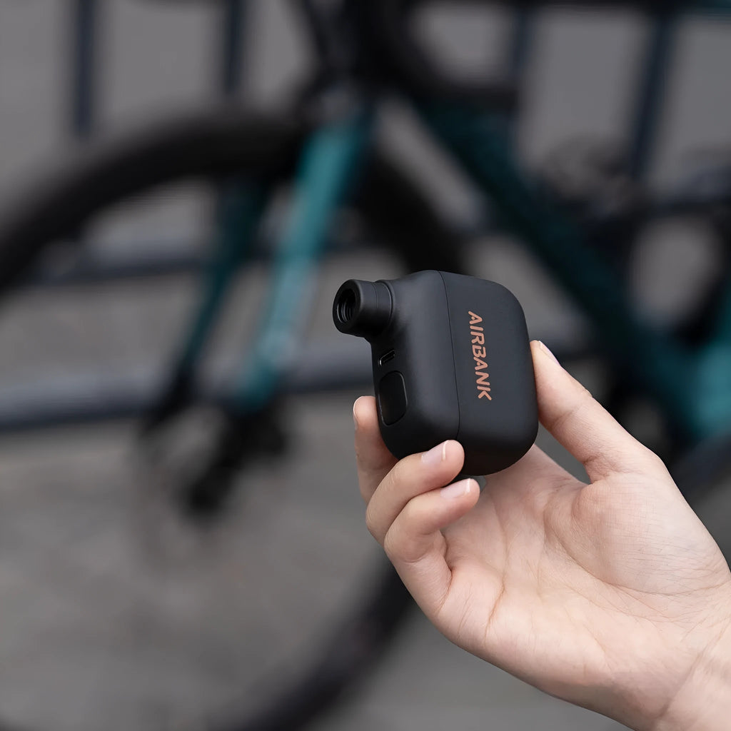 Black USB rechargeable electric bicycle tyre inflator pump with compact dimensions