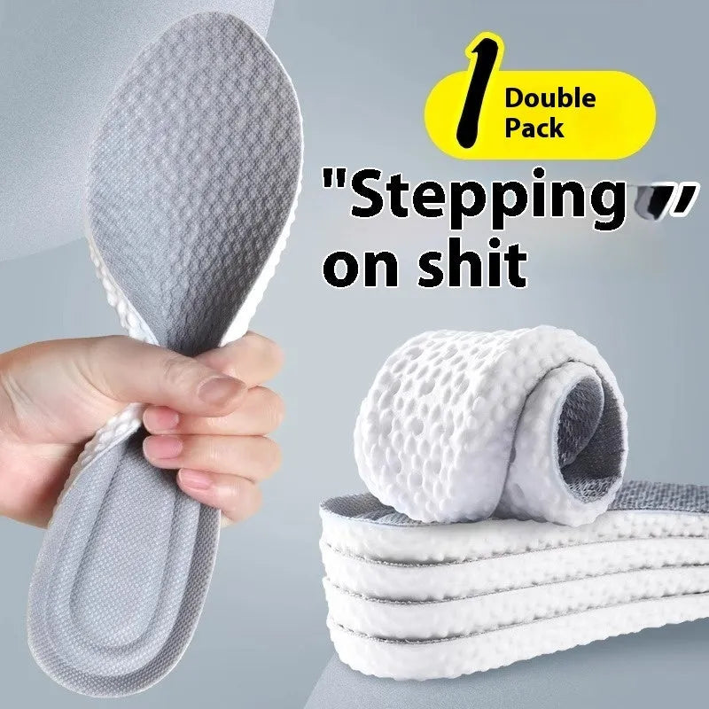 A pair of breathable, soft grey PU sports shoe insoles on a white background, showing their textured surface.