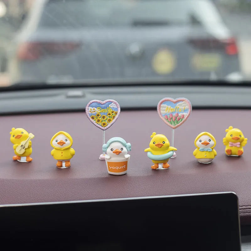 PVC duckling car decoration set with six small duck ornaments and one sign label for dashboard placement