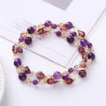 Women's adjustable crystal bracelet with tourmaline, strawberry quartz and amethyst beads on three-ring design