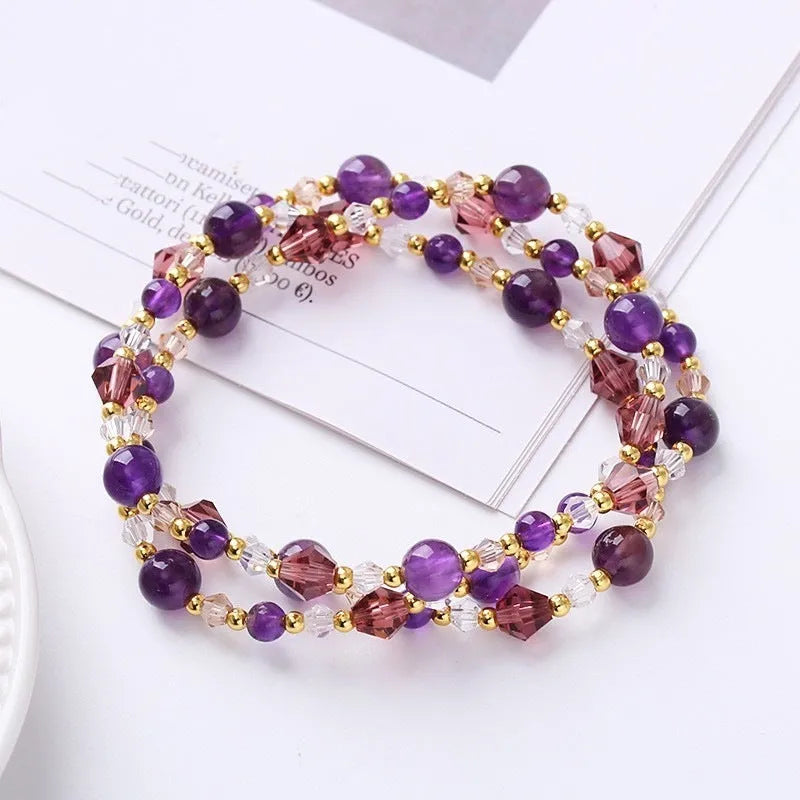Women's adjustable crystal bracelet with tourmaline, strawberry quartz and amethyst beads on three-ring design
