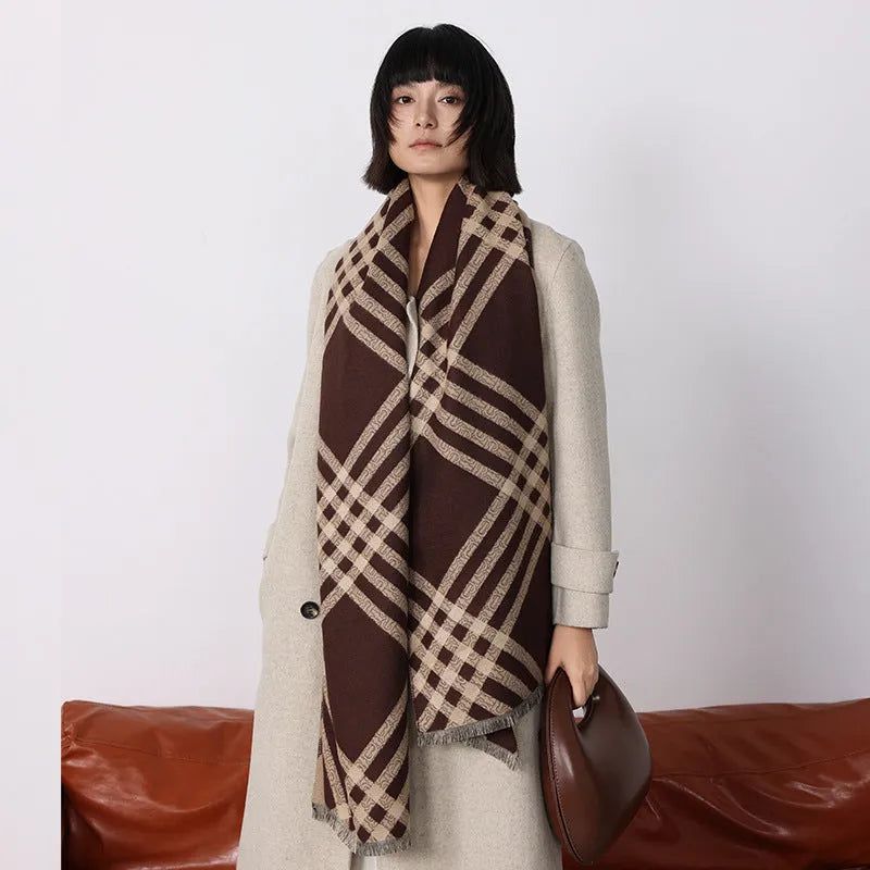 Mid-length brown cashmere-like scarf with tassel ends laid flat.