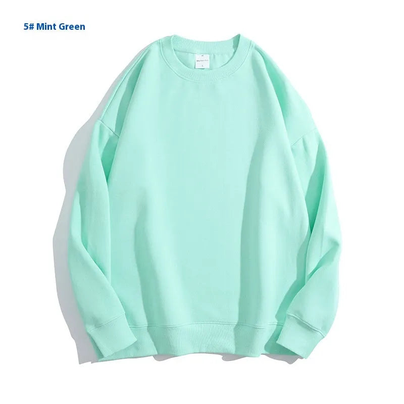Women's loose fit off-the-shoulder cotton sweater in a solid colour, showing round neck and long sleeves.