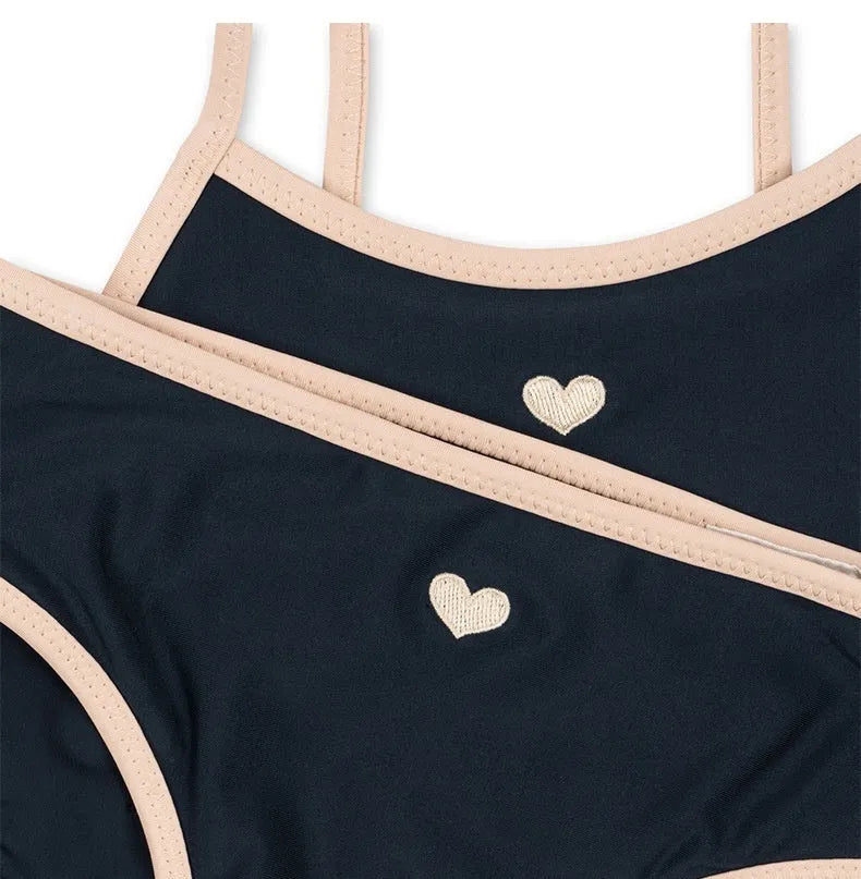 Dark blue girls' split swimsuit briefs made from high elasticity polyester fabric for swimming.